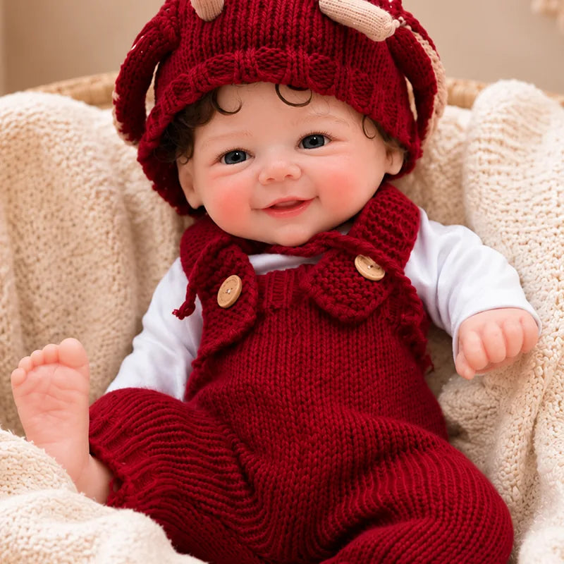 Full Silicone Reborn Baby Doll with a lifelike smiling face, blue eyes, and realistic newborn details.