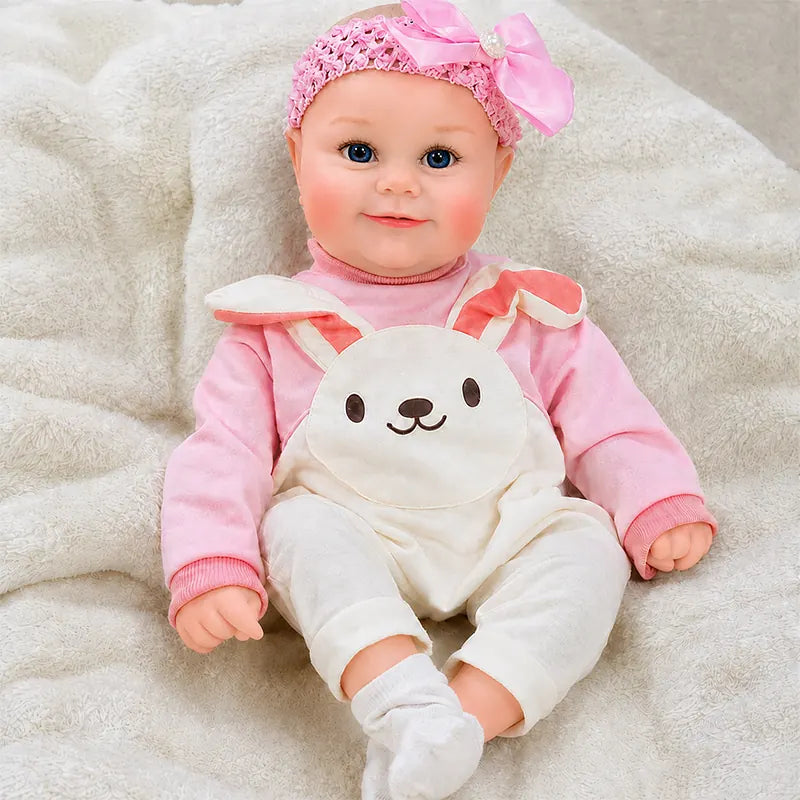 Close view of a reborn doll’s blue eyes, delicate eyelashes, rosy cheeks, and softly painted lips.
