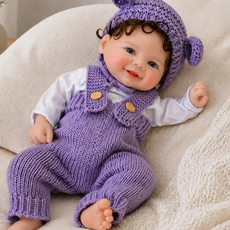 Full Silicone Reborn Baby Doll – Detailed Blue Eyes, Curly Brown Hair and Rosy Cheeks