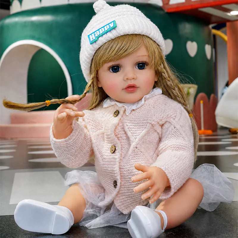 Realistic reborn doll featuring bright blue eyes, rosy cheeks, natural-looking hair, and finely detailed hands for lifelike pretend play.
