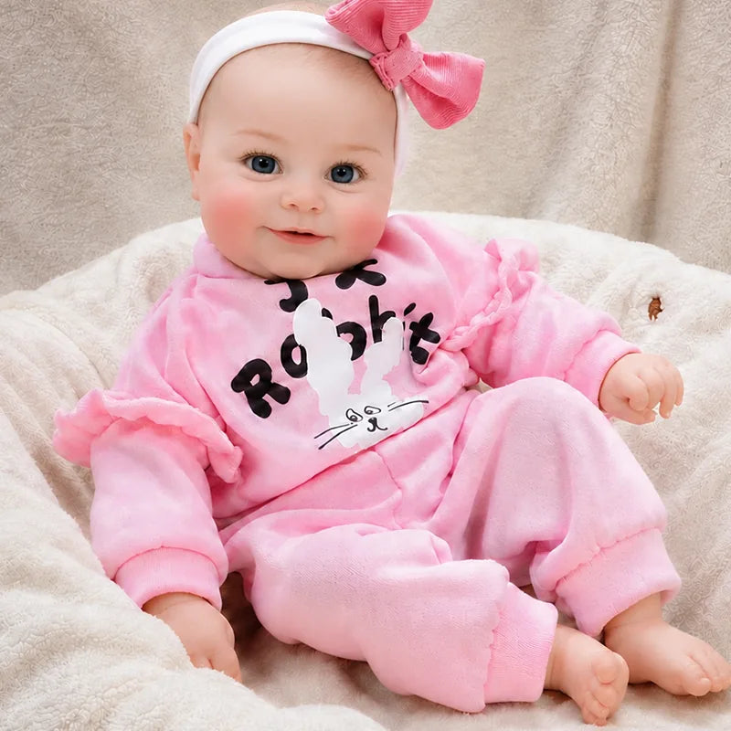 Close-up details of a reborn doll featuring expressive eyes, delicately painted eyebrows, natural blush, and softly colored lips.