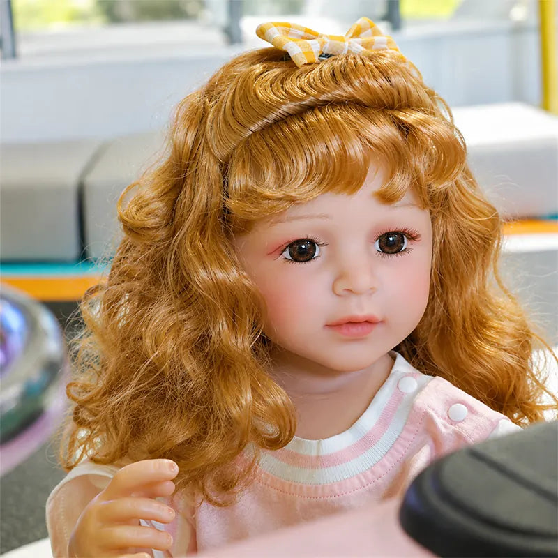 Realistic reborn toddler doll with premium detailing and a joyful expression, ideal for nursery décor, collection displays, and themed photography.