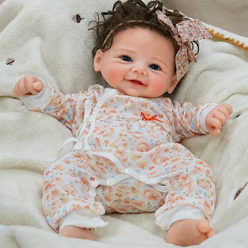 Full Silicone Reborn Baby Doll with Bright Blue Eyes, Curly Brown Hair, and Delicately Sculpted Hands and Feet 