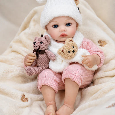 Realistic reborn baby doll with expressive blue eyes and hand-painted details, presented as a heartwarming birthday or holiday gift.