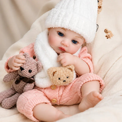 Realistic reborn baby doll with expressive blue eyes and hand-painted details, presented as a heartwarming birthday or holiday gift.