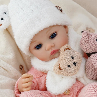 Hand-finished Rosie reborn baby doll with layered skin painting, realistic shading, fine facial details, and carefully crafted limbs.