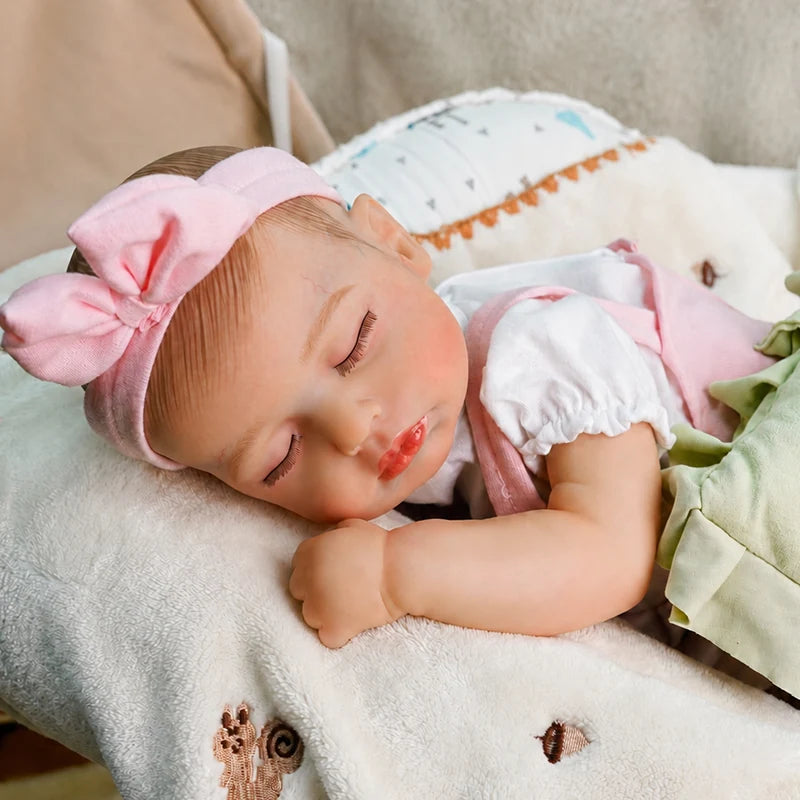 Sleeping reborn baby doll with realistic newborn details with soft cloth body and peaceful  expression