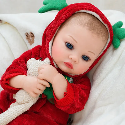 Close view of a realistic reborn doll’s blue eyes, delicate eyelashes, softly painted eyebrows, and natural pink lips.