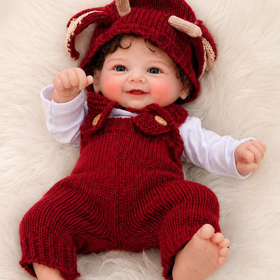 Full Silicone Reborn Baby Doll with bright blue eyes, curly brown hair, rosy cheeks, and detailed hands and feet.
