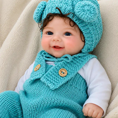 Full Silicone Reborn Baby Doll Wearing a Turquoise Knitted Outfit and Cute Pom-Pom Hat