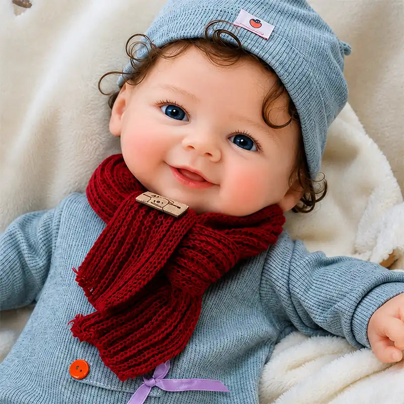 Smiling Full Silicone Reborn Baby Doll Wearing a Grey Outfit, Knitted Hat, and Red Scarf