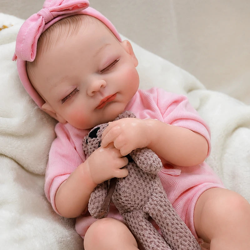 Lifelike reborn baby girl with a teddy bear, a charming birthday or Christmas gift for collectors and children who love nurturing play.