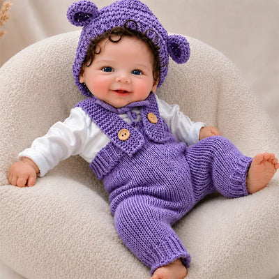 Full Silicone Reborn Baby Doll – Cheerful Baby with Bright Blue Eyes, a Sweet Smile and Purple Bear-Ear Hat