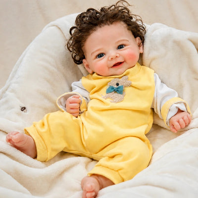 Full-Body Silicone Reborn Baby Doll wearing a cheerful yellow romper with an adorable animal decoration.