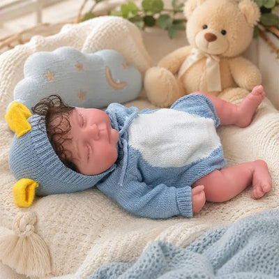 Full Silicone Reborn Baby Doll – Peaceful sleeping baby in a blue knitted animal romper