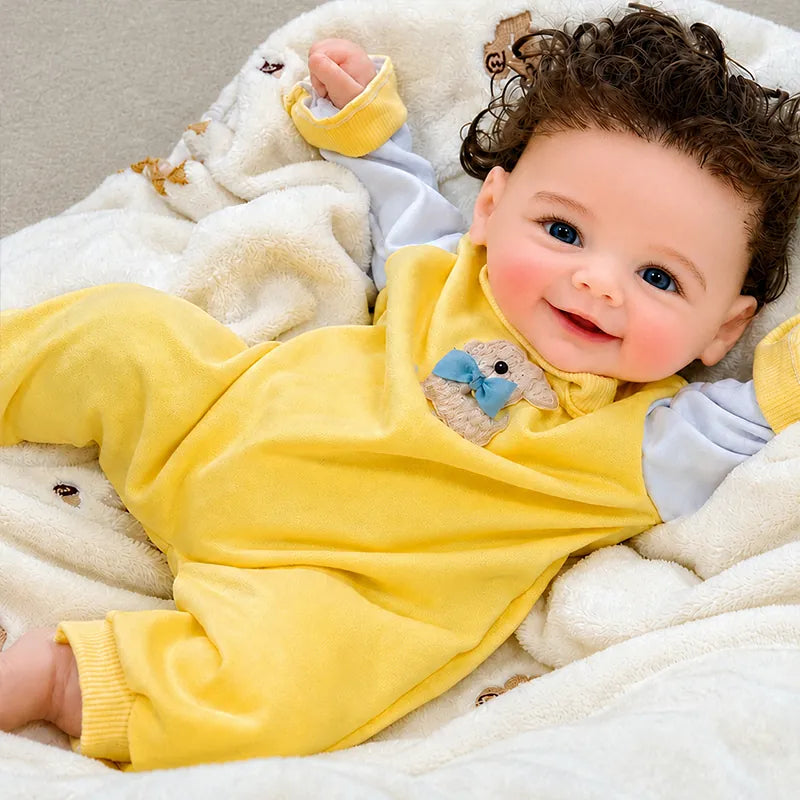 Full-Body Silicone Reborn Baby Doll resting comfortably on a cozy blanket for nursery play and display. 