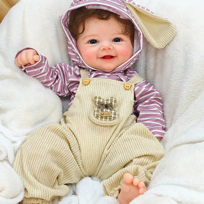 Full Silicone Reborn Baby Doll Wearing a Striped Hooded Outfit and Cream Knitted Overalls with a Sweet Happy Smile