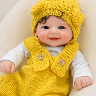 Full Silicone Reborn Baby Doll Resting on a Cozy Cushion for Pretend Play and Display