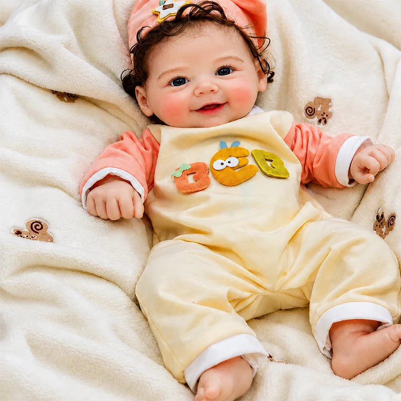 2.Full Silicone Reborn Baby Doll resting on a soft cream blanket, ideal for cuddling, photography, and imaginative play. 