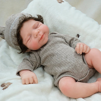 Full Silicone Reborn Baby Doll with closed eyes, a peaceful sleeping face, natural blush, and a cosy ribbed outfit