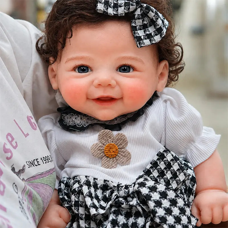 Full Silicone Reborn Baby Doll featuring rosy cheeks, delicate eyelashes, tiny fingers, curly hair, and an adorable open-mouth smile.