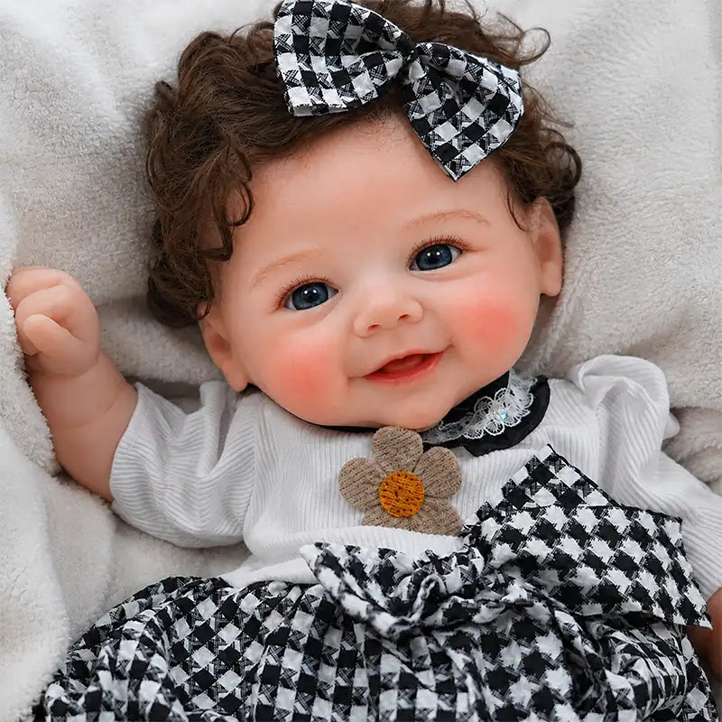 Full Silicone Reborn Baby Doll resting on a soft cream blanket, perfect for nursery displays, photography, and pretend play.