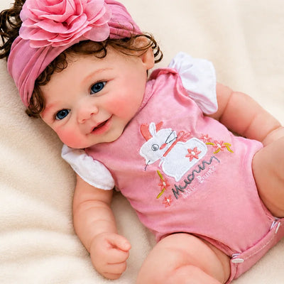 2.Full Silicone Reborn Baby Doll relaxing on a soft nursery blanket, perfect for pretend play, photography, or display. 