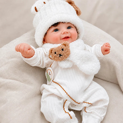 Full Silicone Reborn Baby Doll dressed in a cozy white outfit, perfect for nursery displays, photography, and imaginative play.