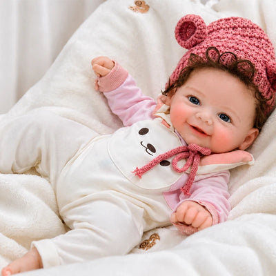 Full Silicone Reborn Baby Doll Resting on a Cozy Blanket for Pretend Play, Display, and Gift Giving