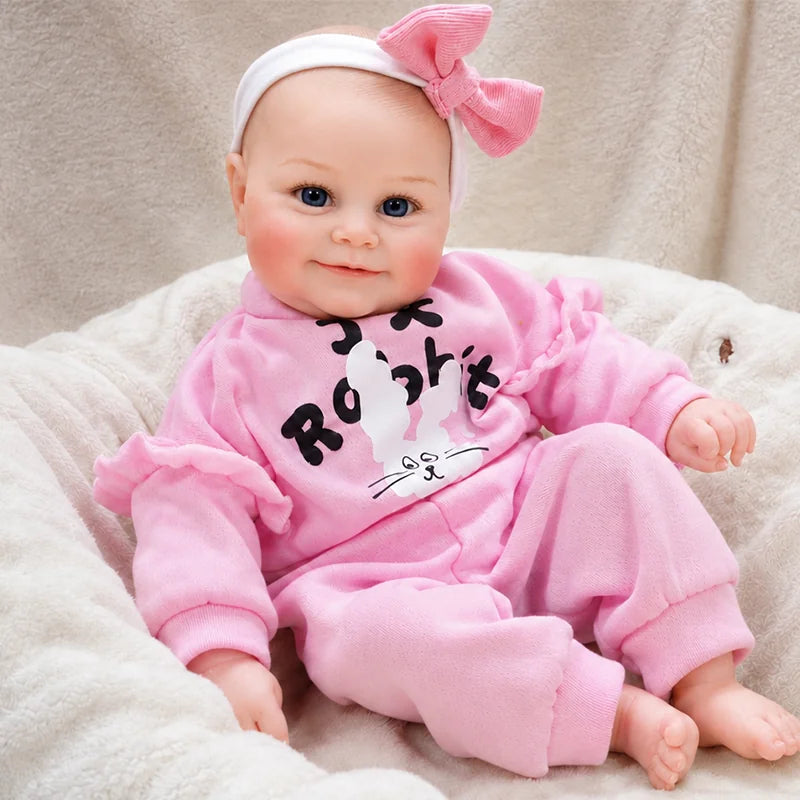 Handcrafted reborn baby doll with layered skin painting, subtle shading, realistic facial features, and finely finished details.