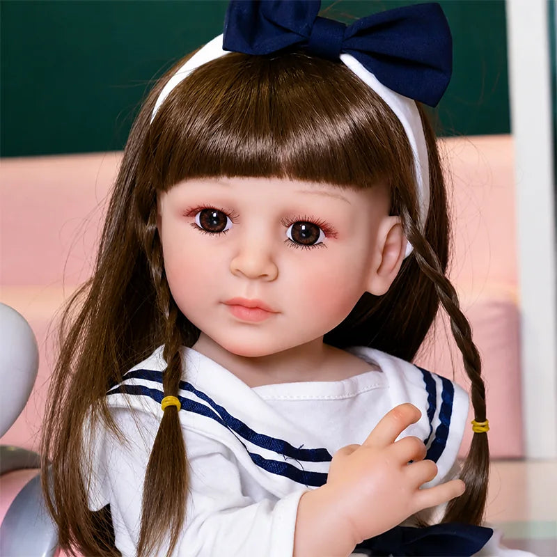 Sophie lifelike reborn doll with realistic brown eyes, softly blushed skin, and beautifully styled brunette hair.